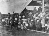 Sikhs on board the Komagata Maru. Many with their hands held high above their heads celebrating .jpg