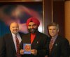 Dr-Jasbir-Kang-at-KVIE-Studios-with-a-copy-of-the-documentary-SIKHS-IN-AMERICA-which-won-an-Emmy.jpg