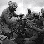 Sikh tying turban to a British soldier in World war 1