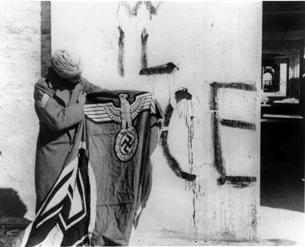 11th Sikh Regiment with captured Nazi flag in Italy
