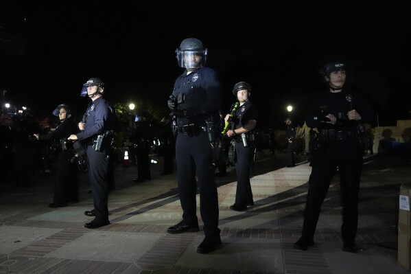 Police prepare to enter an encampment occupied by pro-Palestinian demonstrators on the UCLA campus Thursday, May 2, 2024, in Los Angeles. (AP Photo/Jae C. Hong)
