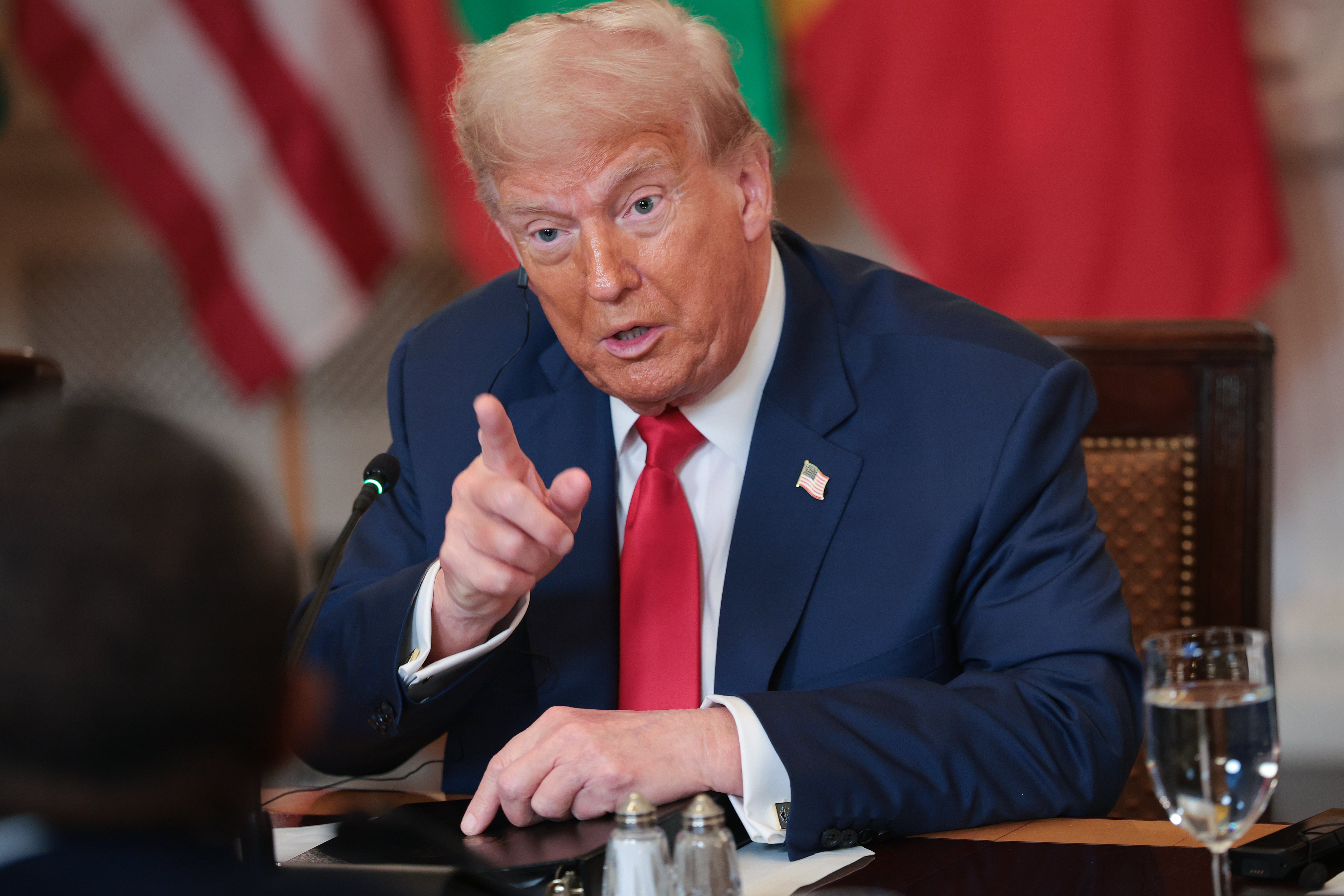 President Donald Trump answers questions during a multilateral lunch with African leaders in the State Dining Room of the White House 9 July 2025 in Washington, DC