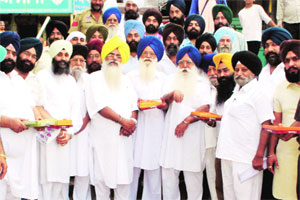 M_Id_228242_Supporters_of_Ravinder_Kaur_celebrate_after_she_was_declared_the_candidate_from_Ludhiana_west.jpg